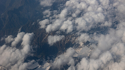 A Breathtaking Scenic Aerial View of Billowing Clouds Floating Above a Beautiful Landscape