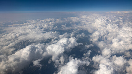 A Breathtaking Scenic Aerial View of Billowing Clouds Floating Above a Beautiful Landscape