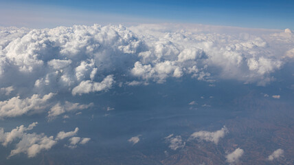 A Breathtaking Scenic Aerial View of Billowing Clouds Floating Above a Beautiful Landscape