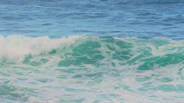 Waves crashing on shore create a serene coastal experience at sunset