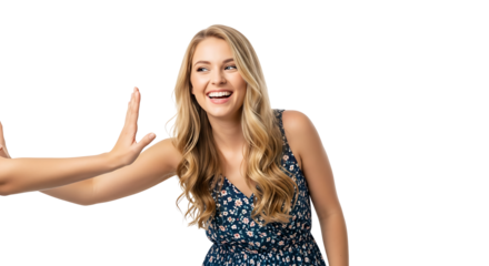 A smiling blonde woman in a floral dress with hands raised in a stop gesture on a black background on transparent background