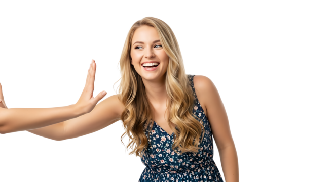 A smiling blonde woman in a floral dress with hands raised in a stop gesture on a black background on transparent background