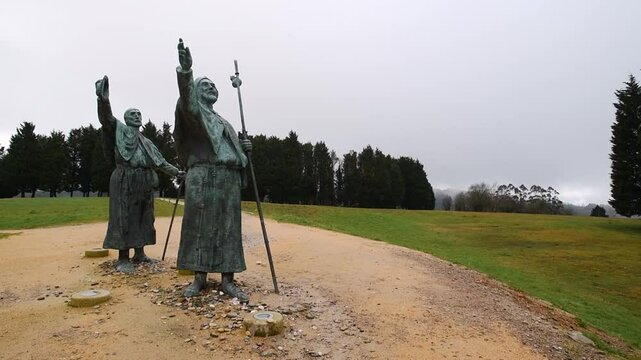Pilgrims sculptures pointing at santiago de compostela on monte do gozo