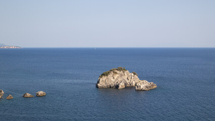 Rocky Islets in the Calm Blue Expanse of the Sea