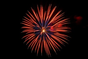 Fototapeta premium Festive Fireworks Display Red and Blue Burst Celebration Night Pyrotechnics