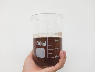 Liquid in graduated beaker laboratory glassware