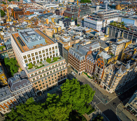 Fototapeta premium Aerial view of Hanover Square and Oxford Street area in London, featuring the entrance to Bond Street (Elizabeth line) station and city streets.