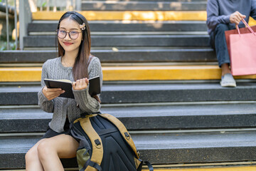 Student reading book for exam preparation gaining knowledge, campus life education journey,...