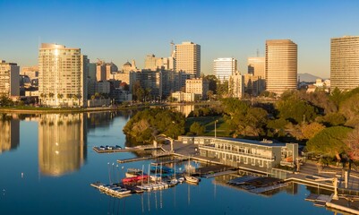 Lake Merritt Boating Center in Oakland, California, USA, offers recreational activities. People...