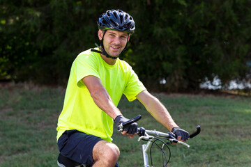 Focused Cyclist Embraces His Daily Ride in Vibrant Reflective Gear