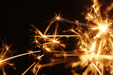 Golden spark of burning handheld firework