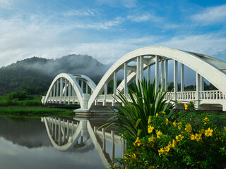 Beautiful landscape, white and pink bridge, Bangkok-Chiang Mai railway line, beautiful landmark of Lamphun province, Thailand..