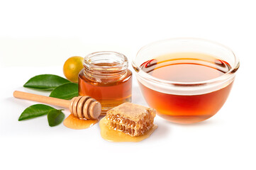 Glass bowl of honey , honey jar, honey comb with leaves isolated on white background.