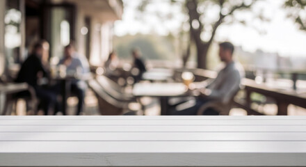 Empty White Table with Blurred Outdoor Cafe Background