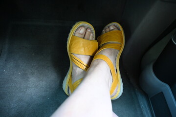 yellow sandals on a woman's foot
