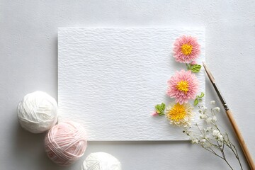 Delicate paper flowers on textured paper.