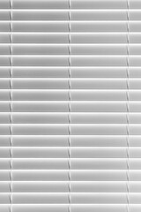 Photo of closed horizontal blinds on a window