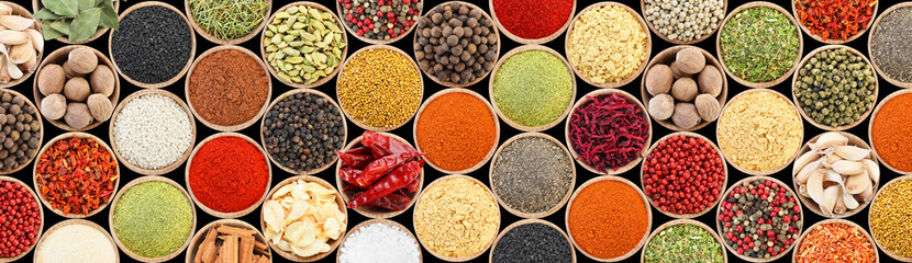 Set of different aromatic spices in bowls on black background, flat lay. Banner design