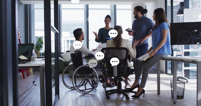 Holding meeting coworkers wearing business attire exchanging ideas in office, with wheelchair
