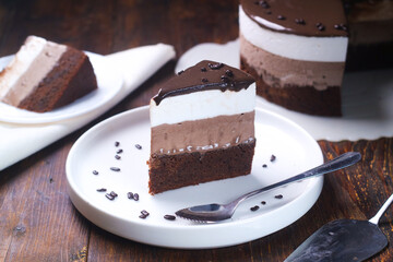 a slice Triple Chocolate Mousse Cake Dessert 
