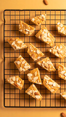 Delicious almond bars arranged neatly on a cooling rack, showcasing their golden-brown color and nutty topping.