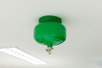 Automated Fire Extinguisher set in building. Fire sprinkler nozzle on ceiling. Automatic fast...