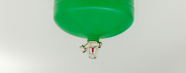Automated Fire Extinguisher set in building. Fire sprinkler nozzle on ceiling. Automatic fast...