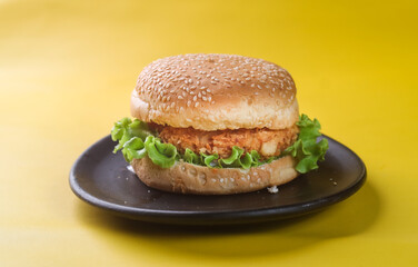 chicken crispy burger on yellow background
