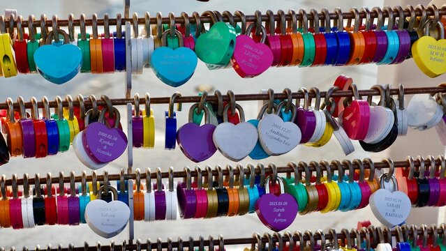 Closeup of an organized colorful love locks display