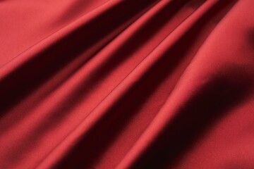 Flowing folds of red silk with smooth shine