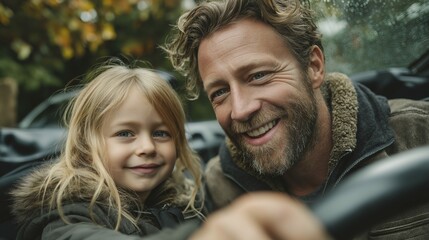 Fototapeta premium Caucasian father and daughter smiling outdoors in autumn with raindrops