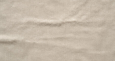 Naklejka premium Natural beige linen fabric with a subtle woven texture and gentle, organic wrinkles. Its earthy tone and soft drapes create a calming and versatile background for various designs.