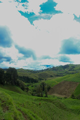 Image where you can see the peak of the mountain and some marvelous landscapes with clouds and...