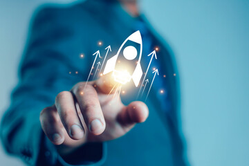 Businessman and rocket start flying up and network line connection. Startup concept Planning and...