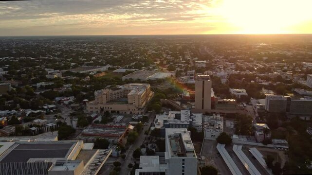 Golden Sunset Over Merida Cityscape With Rainbow Flare