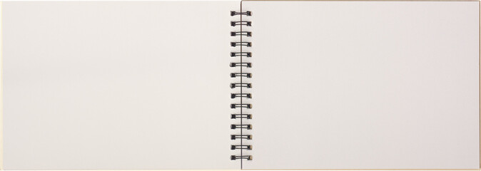 blank sketch book with metal spiral binding lying open isolated white background, copy space of notebook or sketchpad white pages, taken straight from above