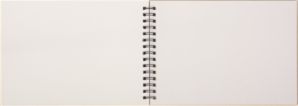 blank sketch book with metal spiral binding lying open isolated white background, copy space of notebook or sketchpad white pages, taken straight from above