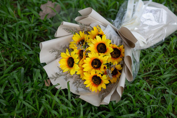 Sunflowers are arranged into a bouquet.