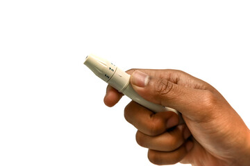 Close-up of hand holding lancing device for blood glucose testing, used for diabetes management