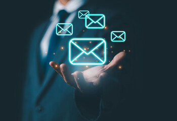   Business email uses technology to send messages, has a mailbox, uses marketing, works on icons, delivers on computers and digital networks, and has a communication channel for receiving newsletters.