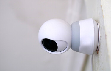CCTV camera installed on the wall of the house.