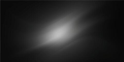 Abstract gray metallic background with a brushed steel texture and a spotlight design