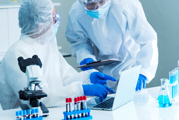 Two asian scientist team reserch chemistry science tube experiment biotech antibody sample in...