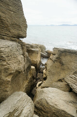 The unique and beautiful shape and composition of rocks at Waipu pancake rocks, New Zealand.