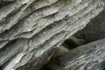 The unique and beautiful shape and composition of rocks at Waipu pancake rocks, New Zealand.