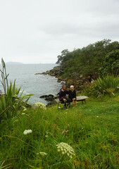 Tourist walking around Waipu pancake rocks in Waipu, New Zealand.	
