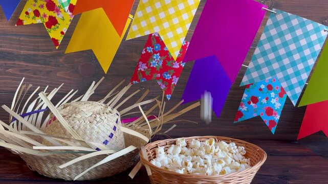 Colorful flags and popcorn on the table. Popcorn, a typical June festival food in Brazil.