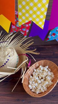 Colorful flags and popcorn on the table. Popcorn, a typical June festival food in Brazil.