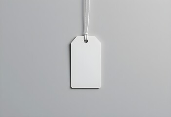 Minimalist White Hanging Rectangular Tag with String on Light Gray Background