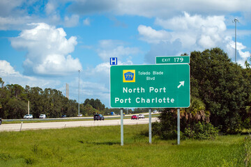 American freeway exit sign in Florida. I-75 highway junction with direction to North Port and Port...
